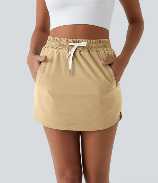 HIGH WAISTED DRAWSTRING POCKET 2 IN 1 CURVED HEM MINI GOLF SKIRT